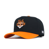 The No Rivals Tennessee Baseball Home Plate Hat is a black and orange snapback with “Vols” and a large orange T logo with “EST 1794” embroidered on the front, orange brim and underside, plus NR stitched on the side.