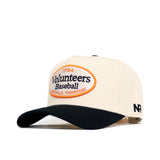 The Tennessee Baseball Slugger Hat by No Rivals is a cream and black snapback with an oval "1794 Volunteers Baseball, Knoxville, Tennessee" patch and embroidered "NR" logo on the left side. Officially licensed design.