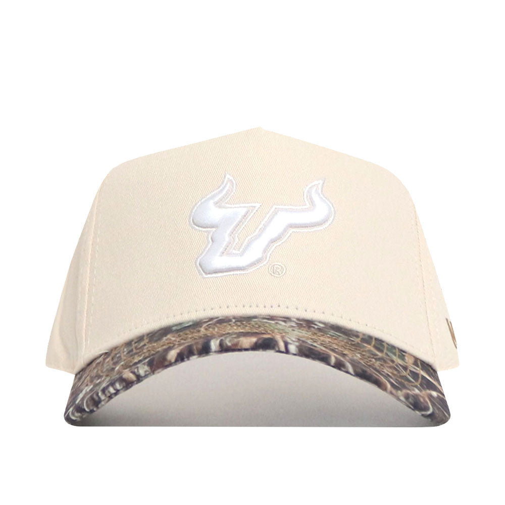 The No Rivals USF Camo Connector Hat features a beige design with a white bull logo, a camo-patterned brim, and a structured high-quality cotton fit.