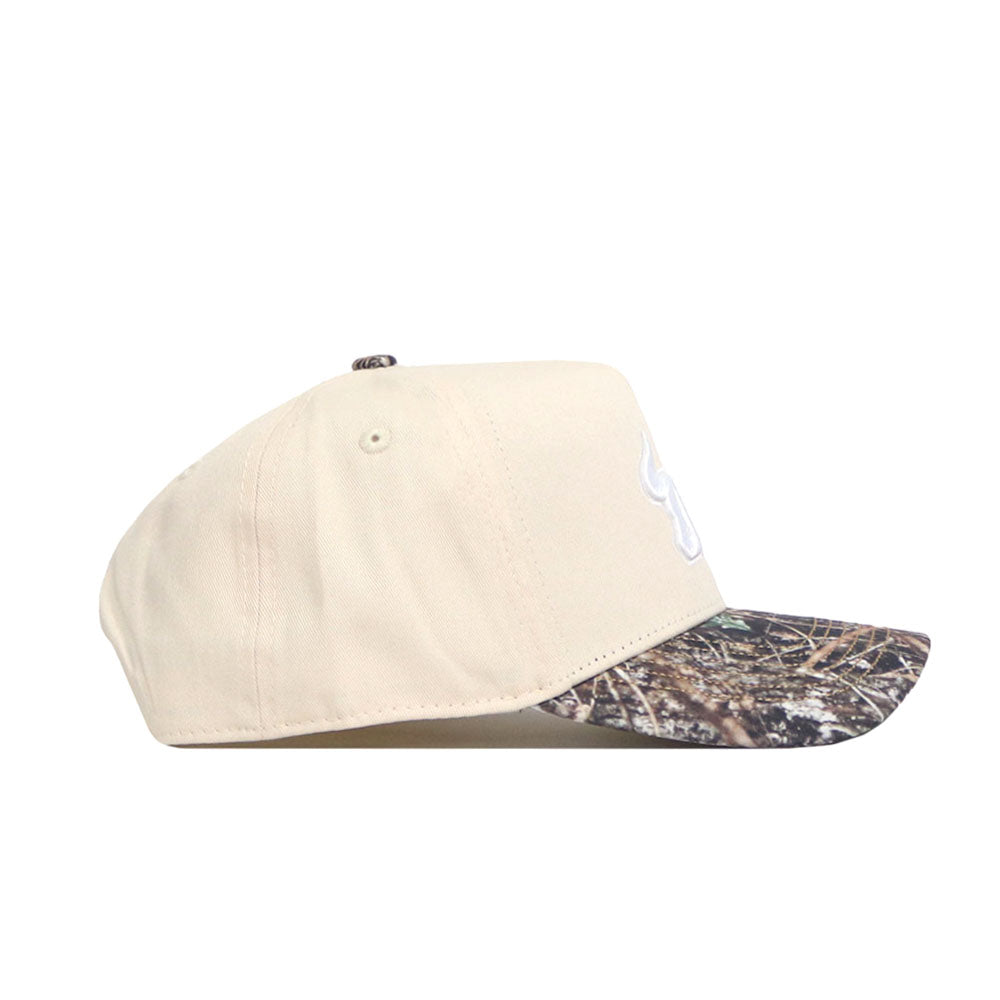 Side view of the No Rivals USF Camo Connector Hat in beige, featuring a camouflage brim, two side ventilation eyelets, and a classic snapback closure.