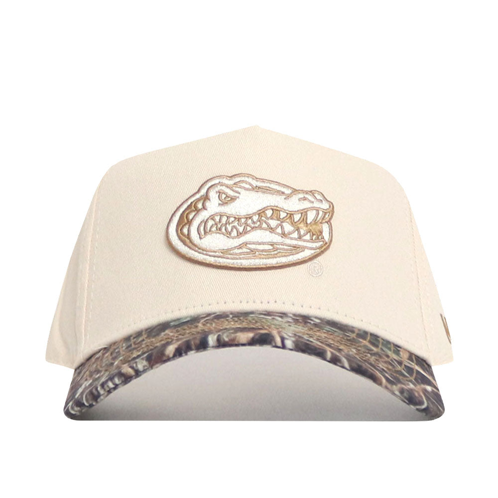 The No Rivals Florida Camo Connector Hat is a beige baseball cap with an embroidered alligator head logo, a camouflage pre-curved brim, and an adjustable snap back for comfort.
