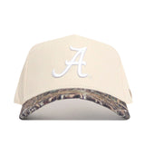 The Alabama Camo Connector Hat by No Rivals features a beige snap back design, white embroidered "A" on the front, camo-patterned brim, and high-quality cotton for a comfortable, structured fit.