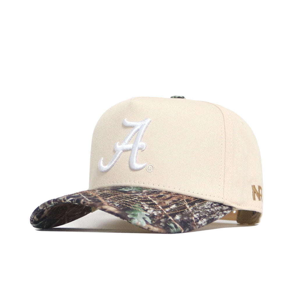 The No Rivals Alabama Camo Connector Hat is a beige cotton snapback cap with a white embroidered "A" on the front and a camo-pattern curved bill for a structured fit.
