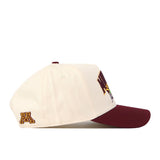 A side-view image of the No Rivals Minnesota Gopher Stadium Hat, a cream and maroon snapback featuring embroidered M logos on the front and side, displayed on a white background.