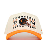 The No Rivals Tennessee Football Kickoff Hat is a white and orange baseball cap featuring an embroidered Tennessee Volunteers 1794 and football helmet logo on the front—perfect for completing your gameday look. It also includes a convenient snapback closure for an adjustable fit.