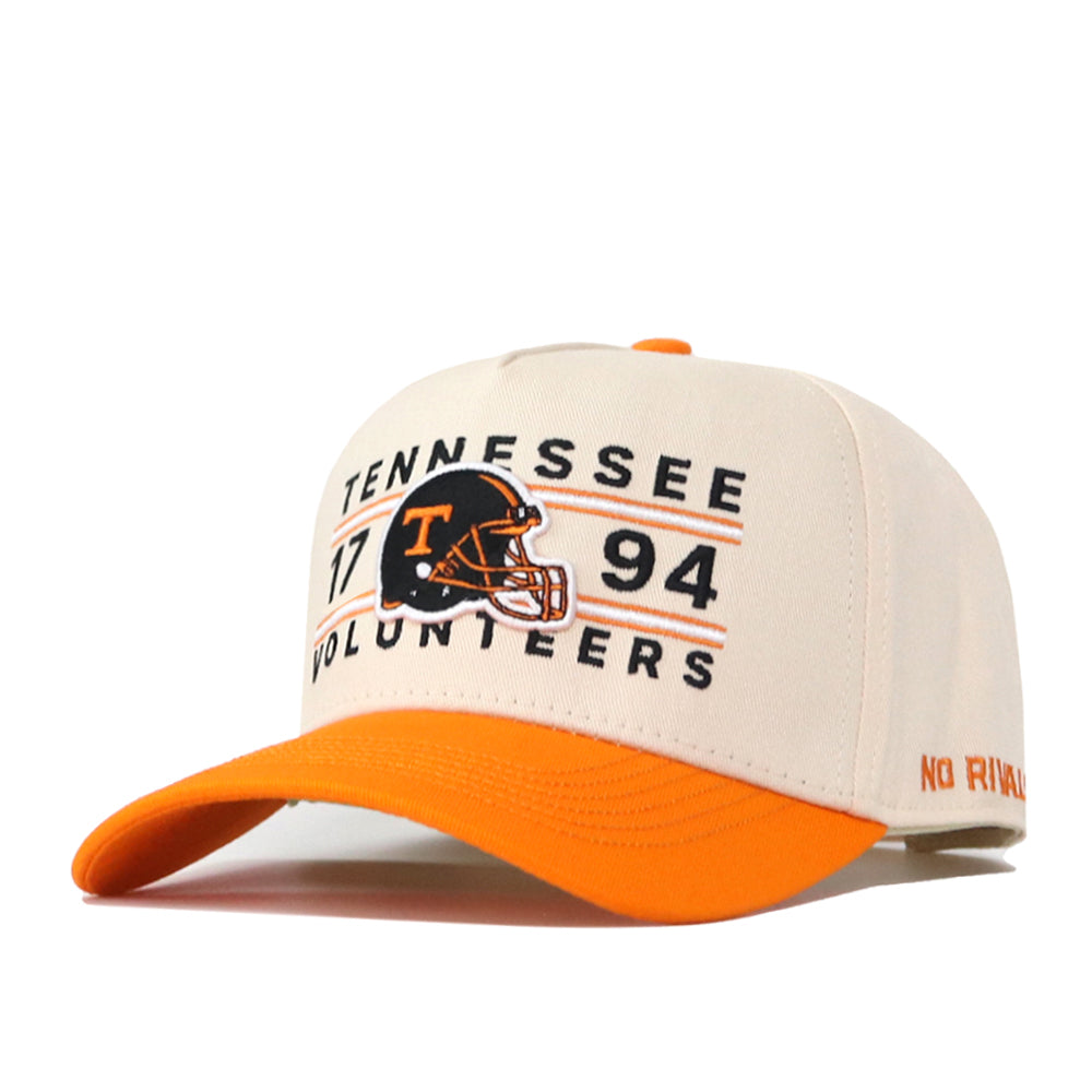 The Tennessee Football Kickoff Hat by No Rivals is a white and orange snapback featuring “Tennessee Volunteers 1794” and a football helmet graphic on the front. The brim and button are orange, while “No Rival” is embroidered on the side. This officially licensed cap also displays an embroidered logo for a bold, team-spirited appearance.