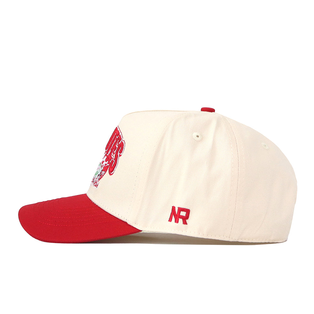 A side-profile view of the No Rivals Utah Utes Stadium Hat, featuring a cream-colored snapback design with a red brim and red NR embroidered logos on the side.