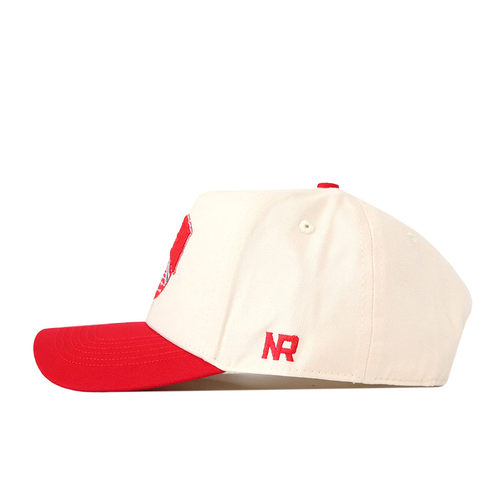 A side profile of the No Rivals EWU Eagles Stadium Hat is shown against a white background, featuring a cream-colored snapback design with a red brim and an embroidered NR logo on the side.
