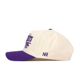 Show off your gameday style with the Kansas State Wildcats Stride Hat by No Rivals—a white snapback featuring a purple brim, matching top button, and embroidered logos. The side displays the purple “NR” initials, while the front is adorned with bold purple text and a partially visible wildcat logo.