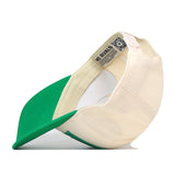 The North Texas Mean Green Stride Hat by No Rivals is turned inside out, displaying its label, interior stitching, and a visible QR code alongside the brand tag. This snap back cap features a green visor paired with a beige crown, while intricate embroidered logos give your game day fit a bold and distinctive touch.