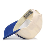 The No Rivals Florida Gators Stride Hat, featuring a cream-colored crown and a blue brim, is shown flipped upside down to display its interior label and an inside QR code. This high-quality baseball cap is crafted from premium cotton material.