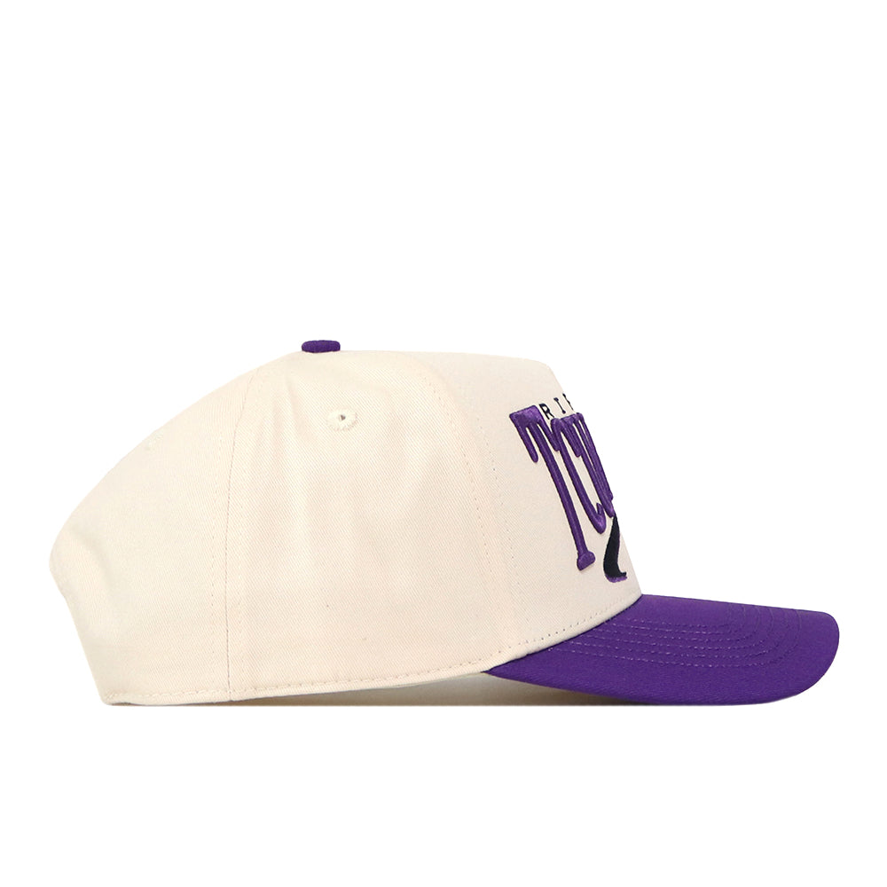 Side view of the No Rivals TCU Horned Frogs Stride Hat, a white snapback cap with a purple brim and raised purple embroidered TCU text on the front, featuring officially licensed embroidered logos.