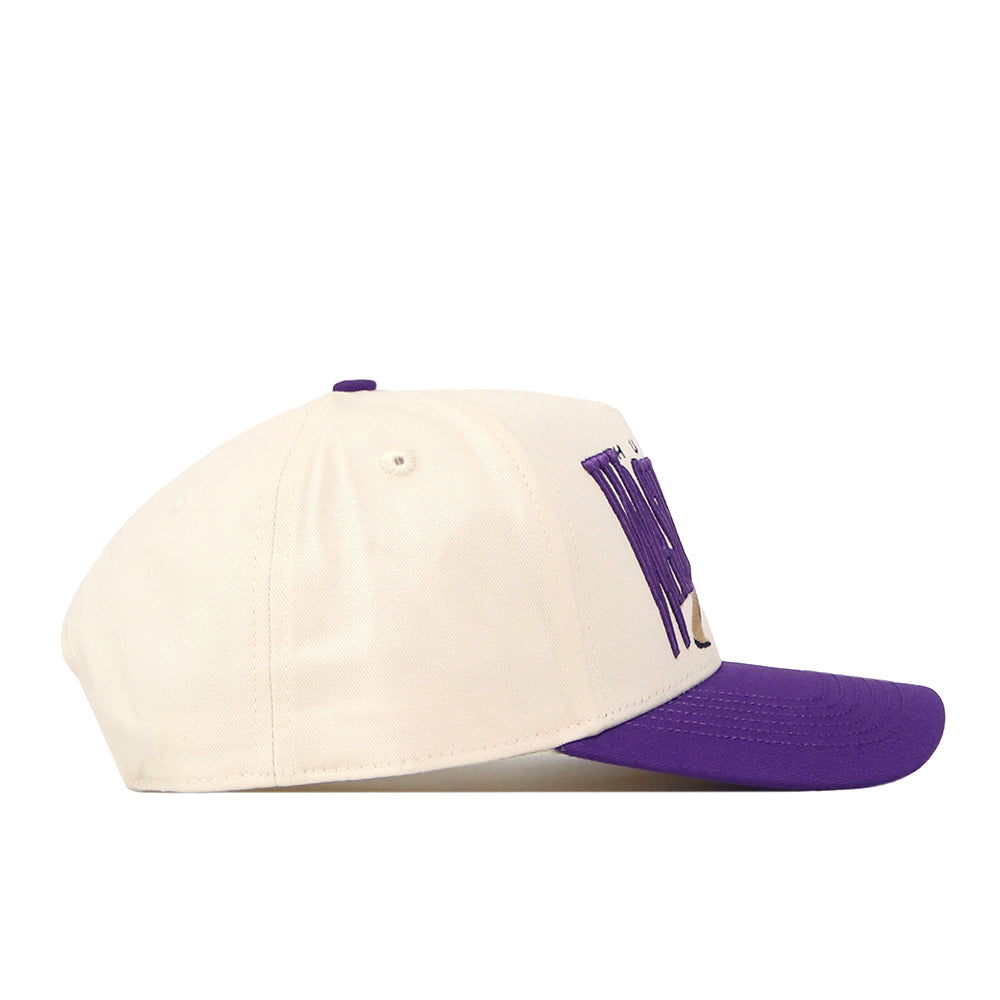 The No Rivals Washington Huskies Stride Hat is a white snapback cap with a purple brim, shown in side profile. The front is adorned with large, purple embroidered Washington Huskies logos, creating a bold and stylish look.