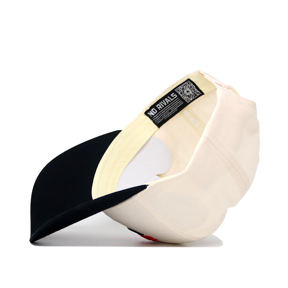The Scheels Longhorn Hat - Black is shown turned inside out, displaying beige and black colors, interior labels, stitching details, a structured fit with a black brim, and a QR code on one of the inside tags.