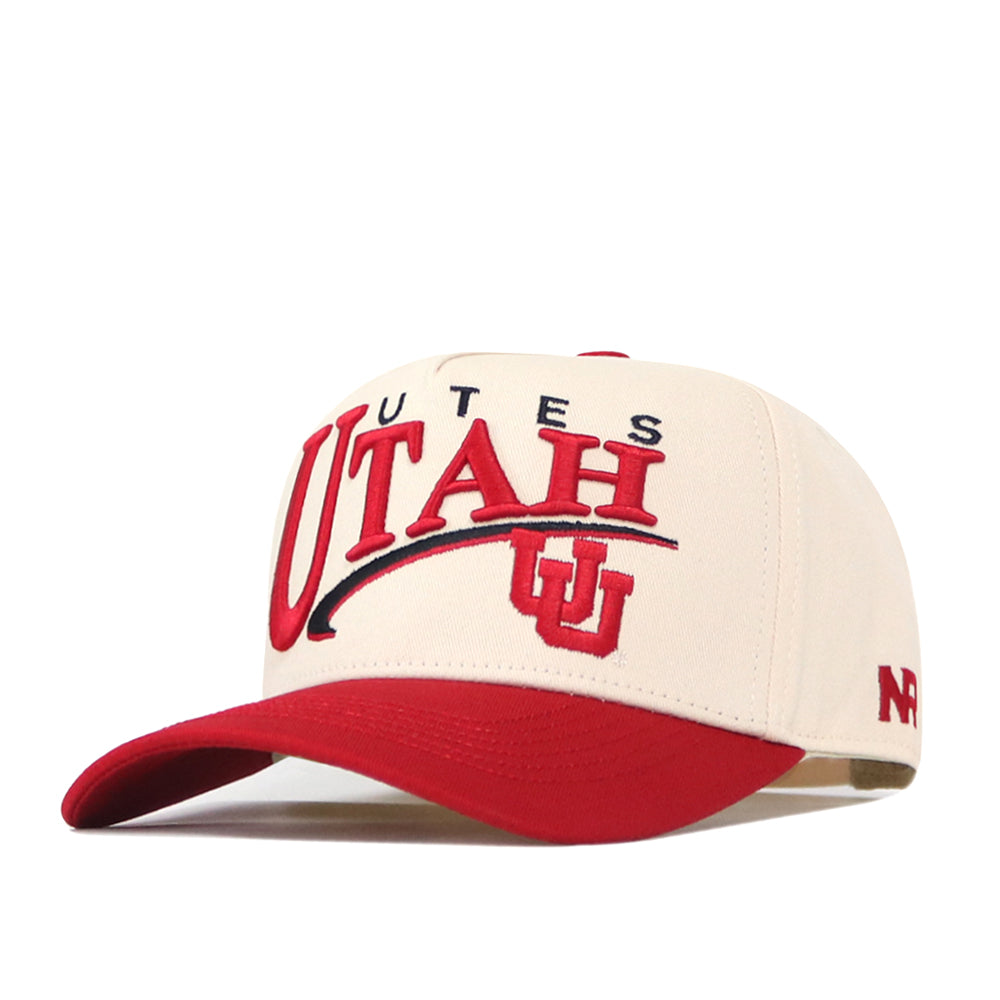 The Utah Utes Stride Hat by No Rivals is a cream and red snapback featuring embroidered University of Utah UU logos on the front and red trim on the brim, officially licensed for authentic Utes representation.