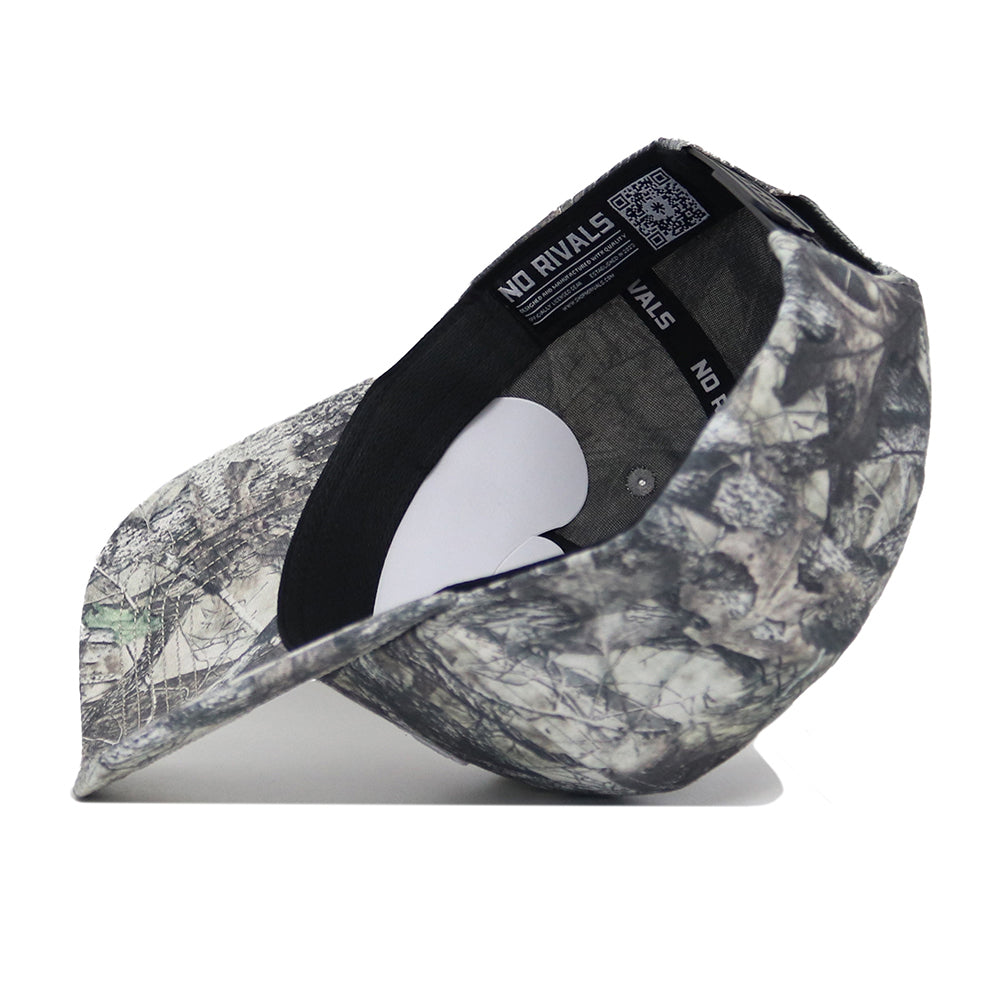 The NC State Outland Hat by No Rivals is a structured snapback with high-quality cotton, gray and green camo, NO RIVALS branding on the sweatband, and an inside QR code label.