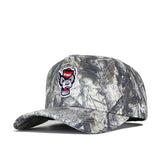 The No Rivals NC State Outland Hat is a camouflage snapback cap with a structured fit and embroidered snarling wolf logo in a red cap on the front, made from high quality cotton and displayed on a white background.