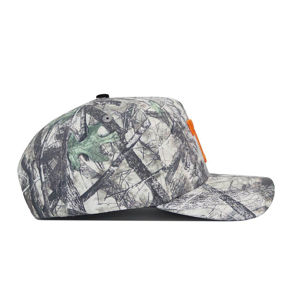 Side view of the No Rivals Tennessee Outland Hat, a structured-fit snapback with a gray, green, and black camo pattern, an orange logo on the front, and a flat brim.
