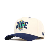 The No Rivals Rice Ballpark Hat is cream-colored with a navy curved brim, featuring an embroidered "San Fran RICE Dual" logo in blue, green, and yellow on the front and a small “NR” logo on the side.