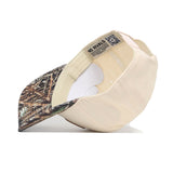 The Miami Camo Connector Hat by No Rivals features a beige and camo pattern, structured fit, white sweatband, interior NO RIVALS label, and is crafted from high-quality cotton.