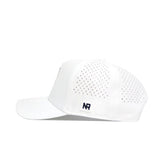 The No Rivals WKU Golf Hat in white features premium structured design, perforated side panels for ventilation, a small black NR logo patch near the back, and an adjustable snapback closure. Shown here in a side view.