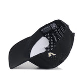 The Vanderbilt Golf Hat - Black by No Rivals is shown upside down, displaying its perforated interior panels, "NO RIVALS" label, and a QR code. The exterior features an embroidered white V logo near the brim.