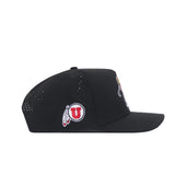 The Utah Golf Hat - Black by No Rivals is a snapback cap shown from the side, with a red U logo accented by feather details in embroidered graphics and small ventilation holes on the back half.