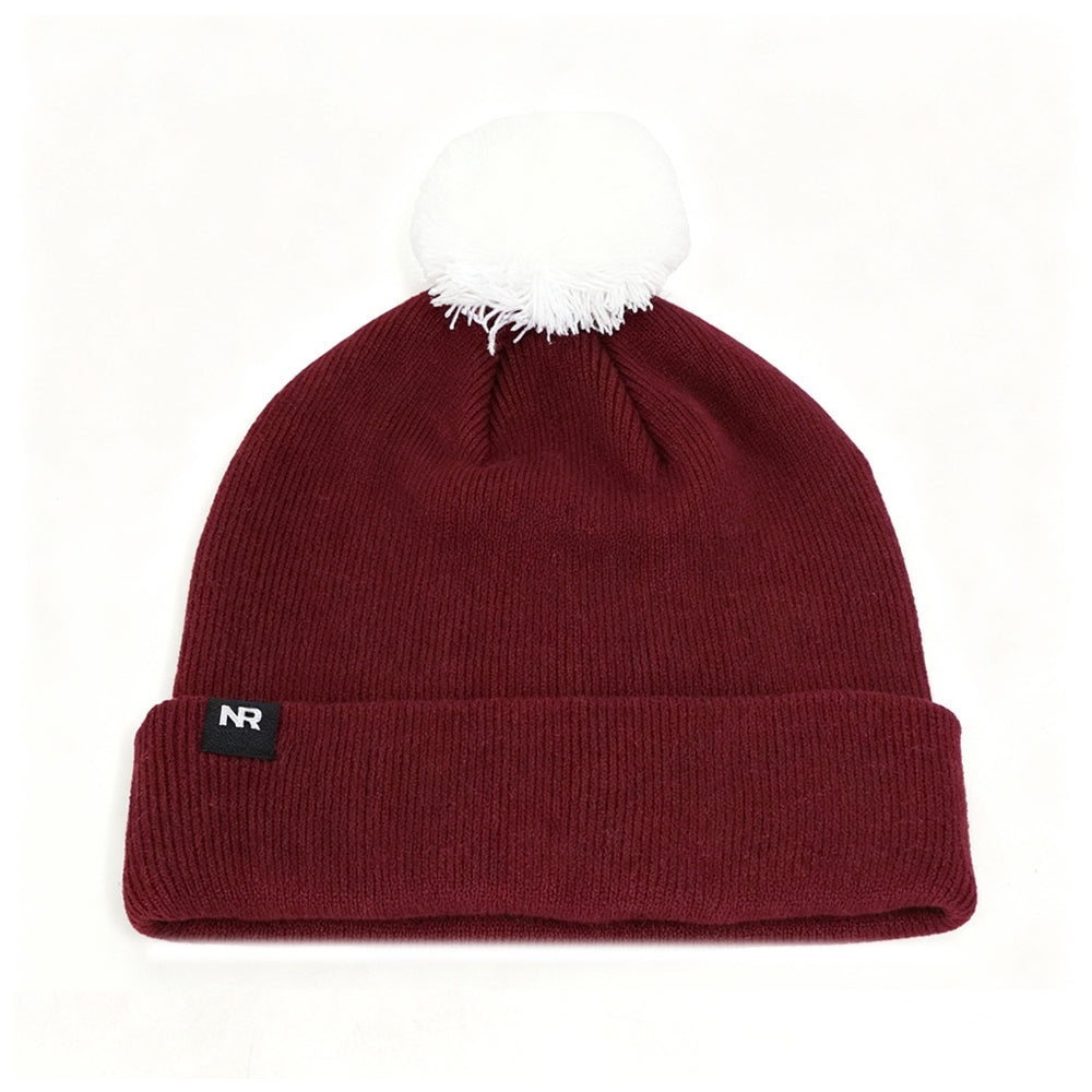 Introducing the Montana Grizzlies Logo Beanie by No Rivals: a maroon knit hat with a white pom-pom on top and a black folded brim patch featuring the NR initials, displayed on a white background—perfect for your next gameday look.