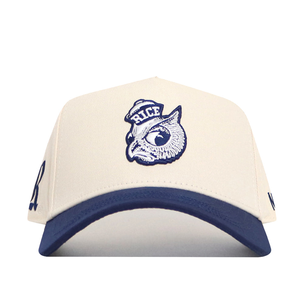 The No Rivals Rice Sammy Sailor Patch Hat is a white snapback with a blue brim, featuring an embroidered owl in a sailor hat labeled “RICE” on the front and partially visible blue text on each side.