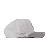 A side view of the No Rivals Iowa Hawkeyes Graphite Hat shows a light gray design with a subtly darker bill, “Hawkeyes” embroidered in script on the side, and an adjustable snap back closure.