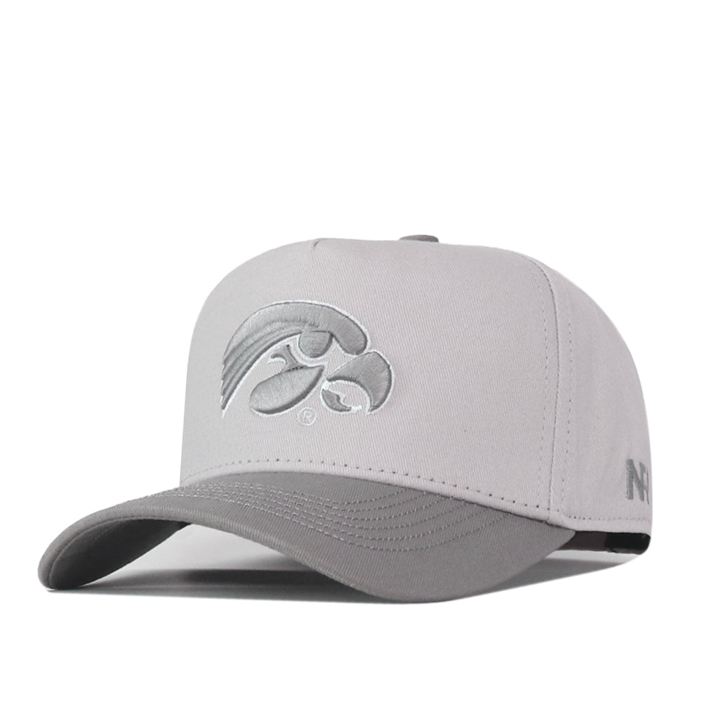 The No Rivals Iowa Hawkeyes Graphite Hat is a light gray snapback baseball cap with an officially licensed, embroidered Iowa Hawkeyes logo on the front panel and a darker gray curved brim.