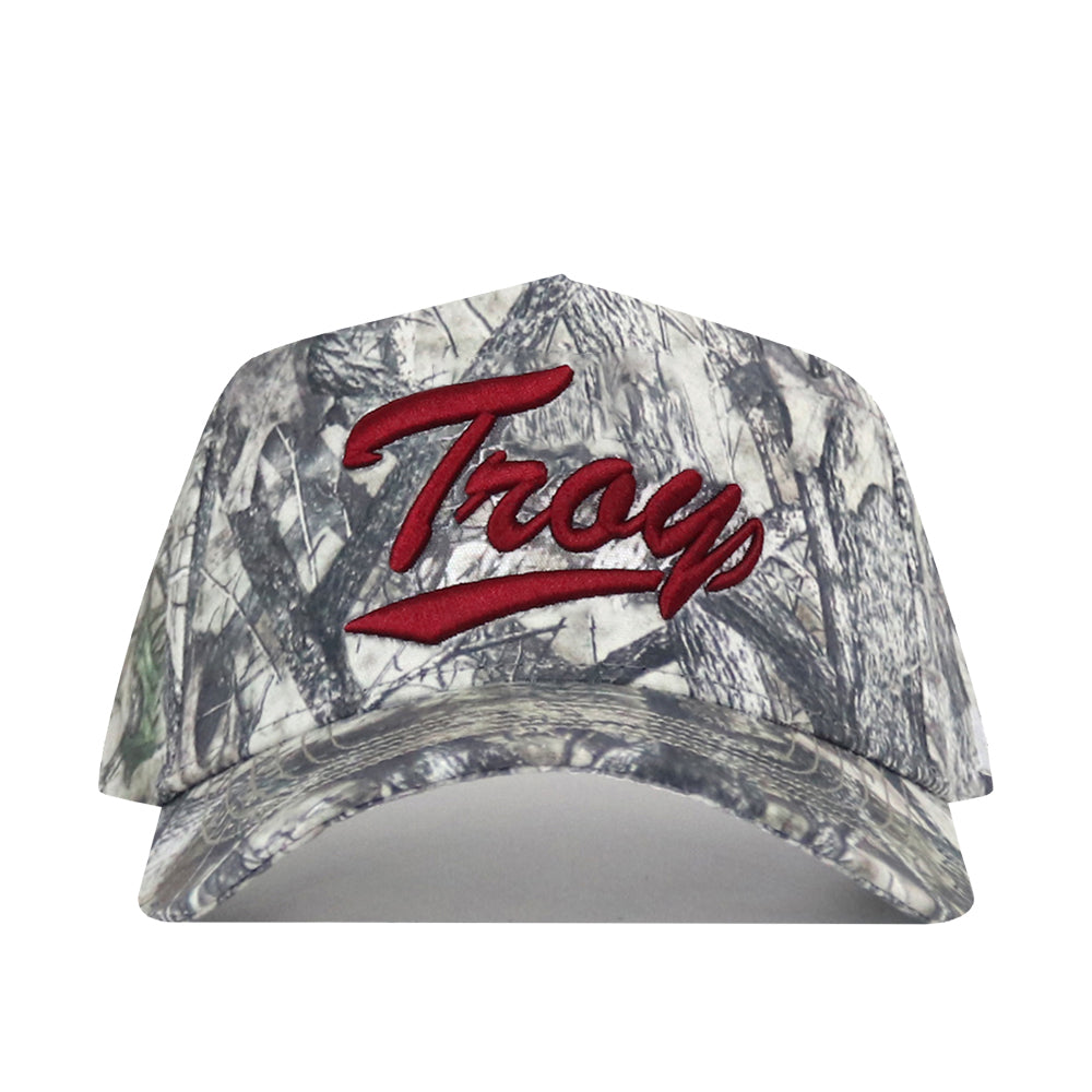 A camouflage baseball cap featuring a bold red “Troy” embroidered logo across the front, complete with a classic snap back for the perfect gameday fit.