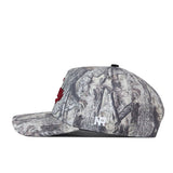 Introducing the Troy Outland Hat by No Rivals—a flat-bill cap showcasing a distinctive gray camouflage pattern. The front features bold red embroidered logo details, complemented by a white NR logo on the side. Designed for comfort and versatility, this hat includes an easy snap-back adjustment for a customized fit.