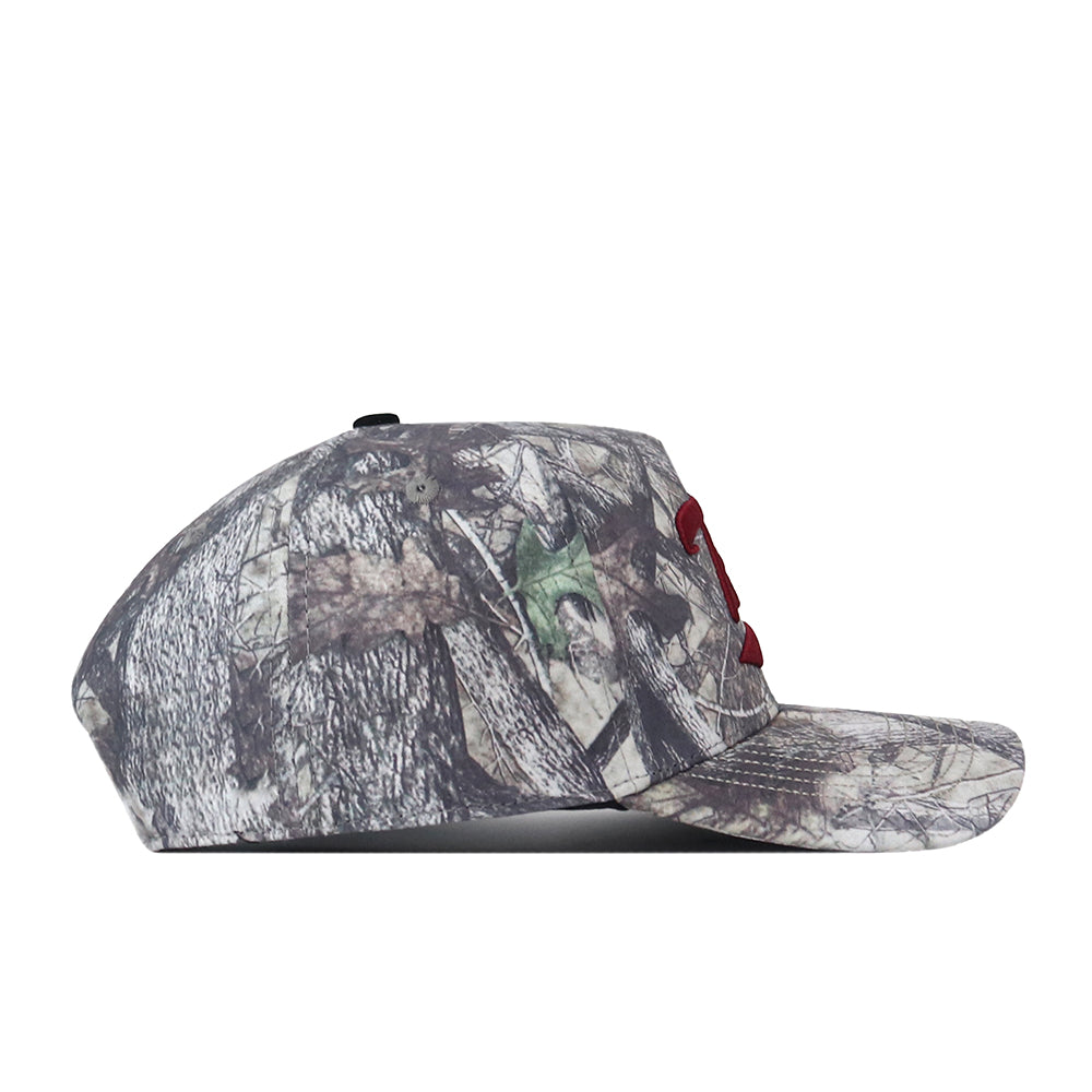 Side view of the No Rivals Troy Outland Hat, featuring a camouflage pattern and a red embroidered logo on the front panel. This cap includes a flat brim, a black button on top, and an adjustable snap back closure for a customizable fit.