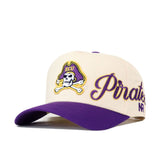 Introducing the No Rivals ECU Pirates Halftime Hat—a beige and purple snapback showcasing a bold pirate logo with "ECU" embroidered on the front and "Pirates" in cursive on the side, perfect for finishing off your gameday look.