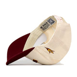 The No Rivals Right Side Up Sun Devils Hat - Arizona State - Classic is pictured upside down to reveal its label, QR code, and a striking embroidered yellow lightning bolt with a maroon outline on the side—an ideal finishing touch for your Gameday Fit.