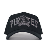 Introducing the No Rivals ECU Pirates Night Mode Hat—a black snapback cap with "Pirates" embroidered in gray and a striking skull-and-crossbones design sporting an ECU-labeled pirate hat on the front. This structured-fit hat is crafted from high-quality cotton to ensure lasting comfort and style.