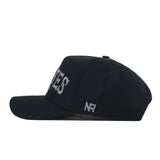 A side view of the ECU Pirates Night Mode Hat by No Rivals, crafted from high-quality cotton. This structured snapback features bold white embroidered letters partially visible on the front and the initials "NR" stitched in white on the side, combining lasting comfort with standout style.