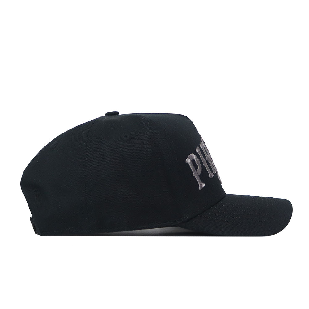 A side-view of the No Rivals ECU Pirates Night Mode Hat—a black snapback cap crafted from high-quality cotton—shows its structured fit and partially visible embroidered white or gray text on the front panel, perfectly balancing durability with classic style.