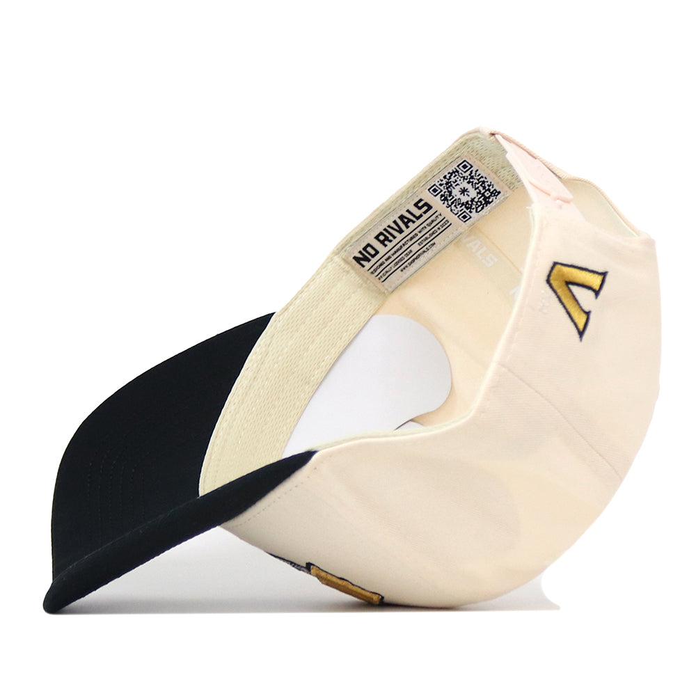 Cream-colored No Rivals Vanderbilt Stadium hat with a black brim, featuring an embroidered yellow V logo on the side and an officially licensed branded label with a QR code inside the crown.