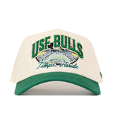 Cream and green USF Stadium Hat featuring an officially licensed embroidered graphic of a stadium with the text USF BULLS and Tampa, Florida.