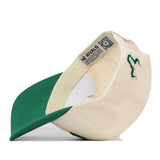 Off-white No Rivals USF Stadium Hat with a green brim and an embroidered emblem on the side, showing the interior sweatband with brand labels.