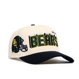 The Baylor Alma Mater Hat by No Rivals is a structured white and black snapback featuring a Baylor football helmet graphic and bold green and gold BEARS lettering across the front.