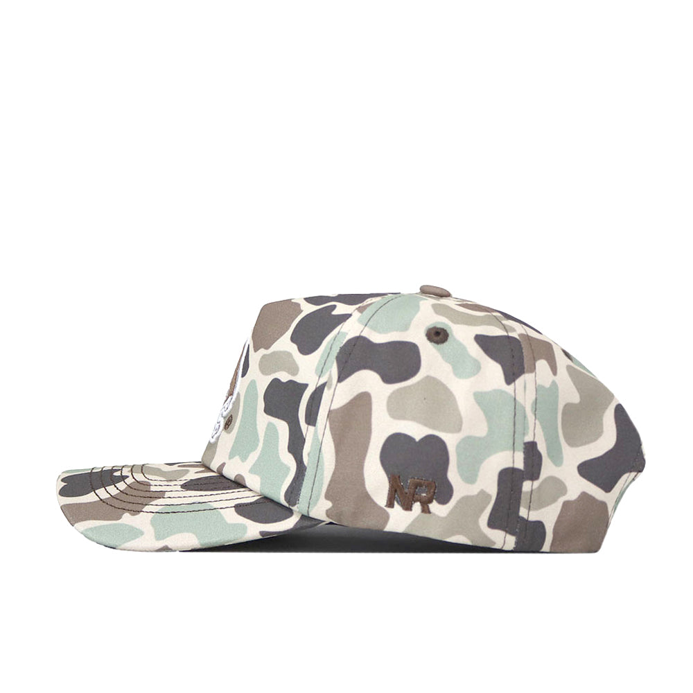 A side view of the No Rivals ECU Pirates Huntsman Hat, a 5-panel cap featuring a camouflage pattern in shades of green, brown, and beige. The hat has a flat brim, an embroidered NR logo on the side panel, and a Snap Back closure.