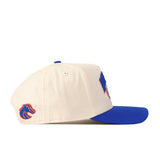 Side view of the Boise State Broncos Stadium Hat by No Rivals—a cream-colored snapback featuring a blue brim and an embroidered blue and orange bronco logo on the side, perfect for completing your gameday fit.