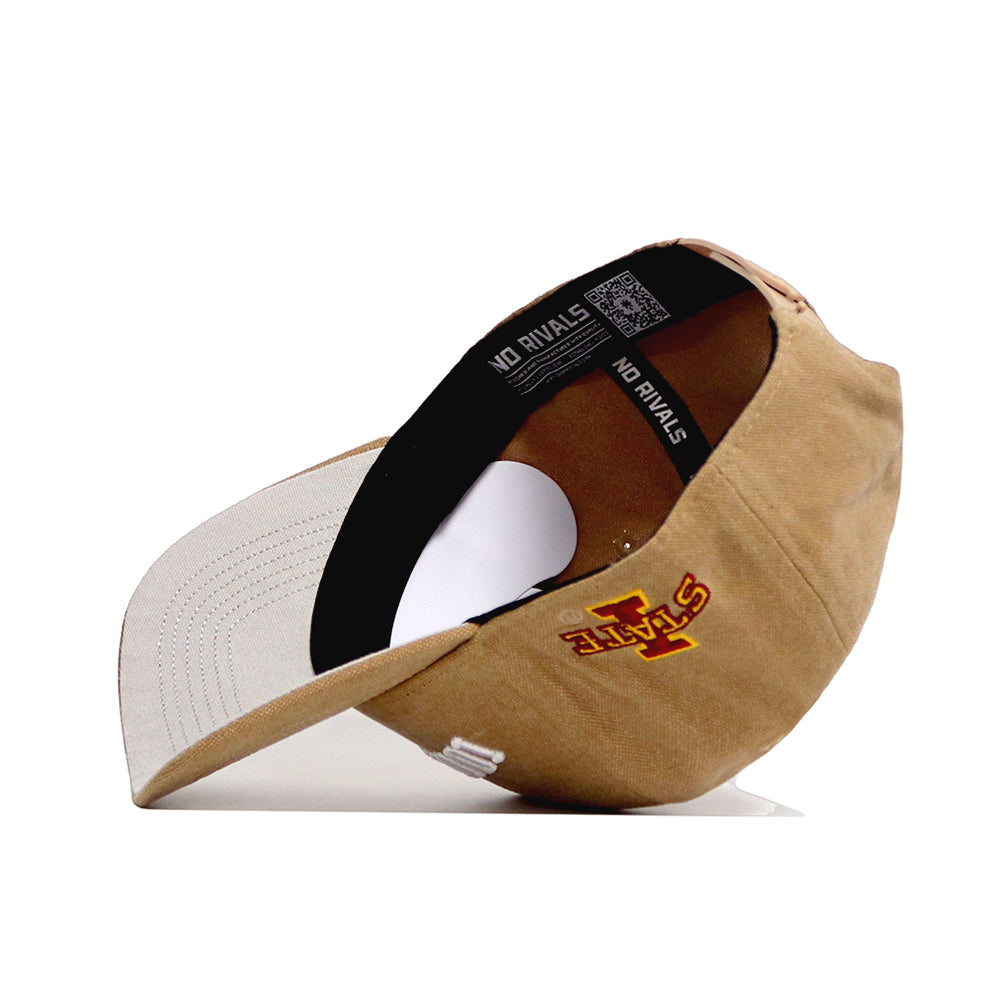 The Iowa State Rustic Hat by No Rivals is a tan cotton canvas structured fit snapback, shown upside down, with a light-colored brim, "NO RIVALS" on the inside band, and a yellow and red STATE logo with an I on the side.