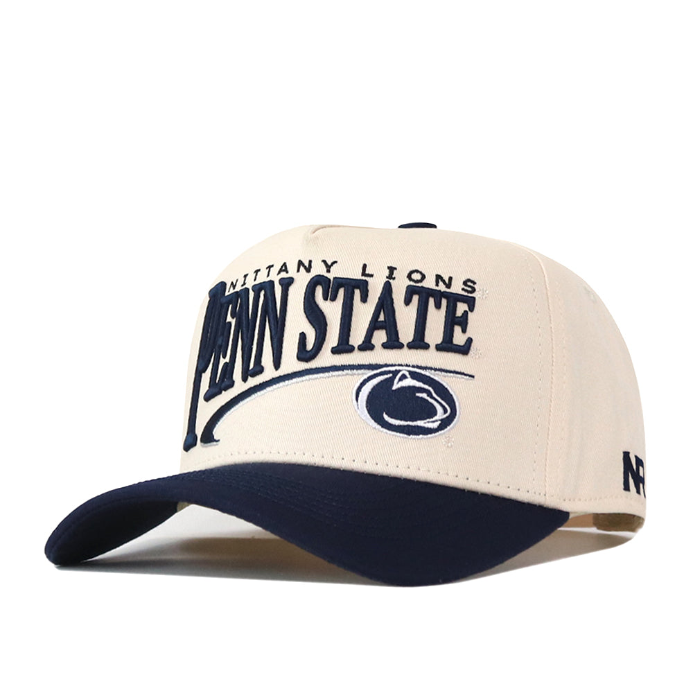Introducing the Penn State Nittany Lions Stride Hat by No Rivals—a cream and navy blue snapback cap featuring “Nittany Lions” and “Penn State” text, along with a lion logo embroidered on the structured front. Crafted from high quality cotton, this hat boasts a classic navy brim for timeless style.