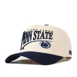Introducing the Penn State Nittany Lions Stride Hat by No Rivals—a cream and navy blue snapback cap featuring “Nittany Lions” and “Penn State” text, along with a lion logo embroidered on the structured front. Crafted from high quality cotton, this hat boasts a classic navy brim for timeless style.