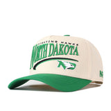 The No Rivals North Dakota Fighting Hawks Stride Hat is a beige and green snapback featuring officially licensed embroidered North Dakota and Fighting Hawks logos, including the iconic Fighting Hawks emblem on the front.