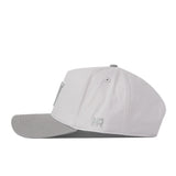 A graphite Washington Huskies hat by No Rivals, featuring a slightly darker gray brim and subtle stitching, is shown in side view. A small embroidered logo near the back adds the perfect finishing touch for your Gameday Fit.